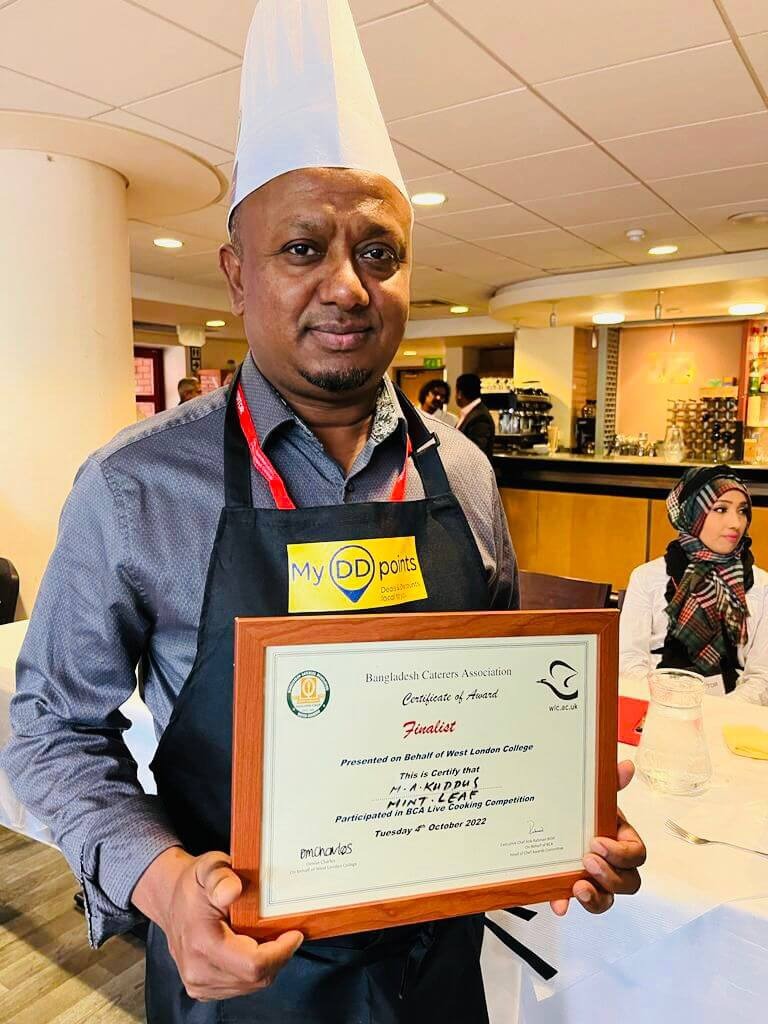 chef-holding-award-certificate.jpeg